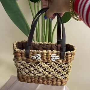 Woven Straw Tote with Shell Accents and Dark Brown Handles